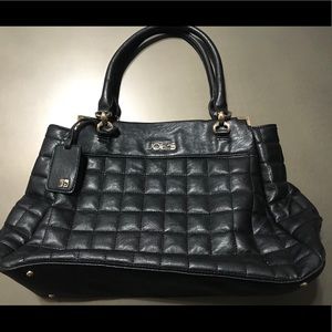 Joe’s black quilted purse with gold accents